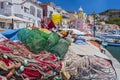 Pretty fishing village, colourful fishermen`s houses, and fishing nets, Marina Corricella Procida Island, Bay of Naples, Italy