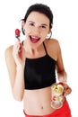 Pretty fit woman eating fruit salad Royalty Free Stock Photo