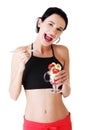 Pretty fit woman eating fruit salad Royalty Free Stock Photo