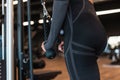 Pretty fitness woman with sexy body doing exercise and trains in the gym, closeup Royalty Free Stock Photo