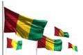 Pretty five flags of Guinea are waving isolated on white - illustration with soft focus - any feast flag 3d illustration