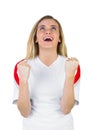 Pretty football fan in white cheering Royalty Free Stock Photo