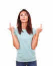 Pretty friendly woman pointing up her fingers Royalty Free Stock Photo