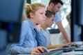 pretty frustrated female student looking at desktop