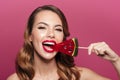 Pretty funny lady eating lollipop like watermelon isolated Royalty Free Stock Photo