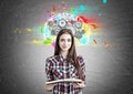 Pretty geek girl with a book and brain cogs Royalty Free Stock Photo