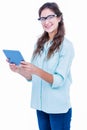 Pretty geeky hipster smiling at camera and holding tablet Royalty Free Stock Photo