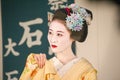 Geisha with white face in traditional Japanese festivals