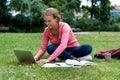 Pretty german female student at computer learning and preparing for degree Royalty Free Stock Photo