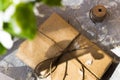 Pretty gift box wrapped with brown craft paper and decorated with jute