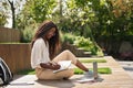 Pretty girl African black student elearning outside studying with laptop. Royalty Free Stock Photo