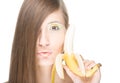 Pretty girl with banana isolated on white. Royalty Free Stock Photo