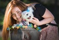 Pretty girl with bicycle and Maltese dog Royalty Free Stock Photo
