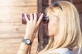 Pretty girl with binoculars looking at the horizon Royalty Free Stock Photo