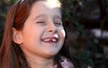 Pretty girl with brown hair and happy expression