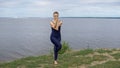 Pretty girl in classical yoga pose, energy concentration