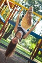 Pretty girl on climbing frame in park Royalty Free Stock Photo