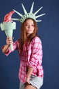 Pretty girl with crown and torch represents statue of liberty Royalty Free Stock Photo