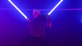 Pretty girl dancing freestyle in club neon lights. Woman dancer moving body.