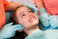 Pretty girl at the dentist, examination of the tempromandibular joint