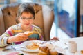 Pretty girl eating breakfast Royalty Free Stock Photo