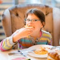 Pretty girl eating breakfast Royalty Free Stock Photo