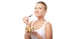 Pretty girl eating fruit salad isolated Royalty Free Stock Photo