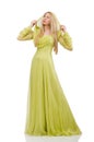 Pretty girl in elegant green dress isolated on Royalty Free Stock Photo