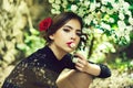 Pretty girl with fashionable spanish makeup, rose flower in hair Royalty Free Stock Photo