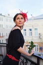 Pretty girl with flower on balcony outdoor Royalty Free Stock Photo