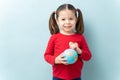 Pretty girl with a globe in her hands Royalty Free Stock Photo