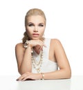 Pretty girl with gold, pearls and white coral jewelry isolated on white, fashion portrait Royalty Free Stock Photo