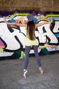 Pretty girl with gray hat dancing ballet