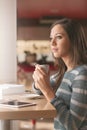 Pretty girl having a coffee at the bar Royalty Free Stock Photo