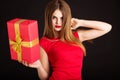 Pretty girl is holding gift box, Christmas time Royalty Free Stock Photo