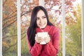 Pretty girl holding warm drink Royalty Free Stock Photo