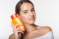 Pretty girl with jar of sunscreen lotion Royalty Free Stock Photo