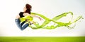 Pretty girl jumping with green abstract liquid dress Royalty Free Stock Photo