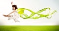 Pretty girl jumping with green abstract liquid dress Royalty Free Stock Photo