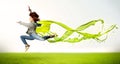 Pretty girl jumping with green abstract liquid dress Royalty Free Stock Photo