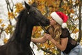 Pretty girl kissing a horse