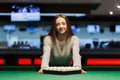 Pretty girl leaned on a pool table Royalty Free Stock Photo