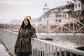 Pretty girl leaning on a bridge railings Royalty Free Stock Photo