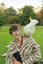 Pretty girl with a parrot on her shoulder Royalty Free Stock Photo