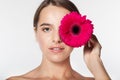 Pretty girl with perfect skin and red flower Royalty Free Stock Photo