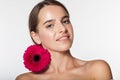 Pretty girl with perfect skin and red flower Royalty Free Stock Photo