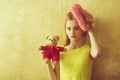 Pretty girl with pink wicker heart and bear toy Royalty Free Stock Photo