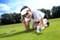 Pretty girl playing golf on grass Royalty Free Stock Photo