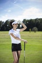 Pretty girl playing golf on grass Royalty Free Stock Photo