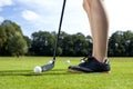 Pretty girl playing golf on grass Royalty Free Stock Photo